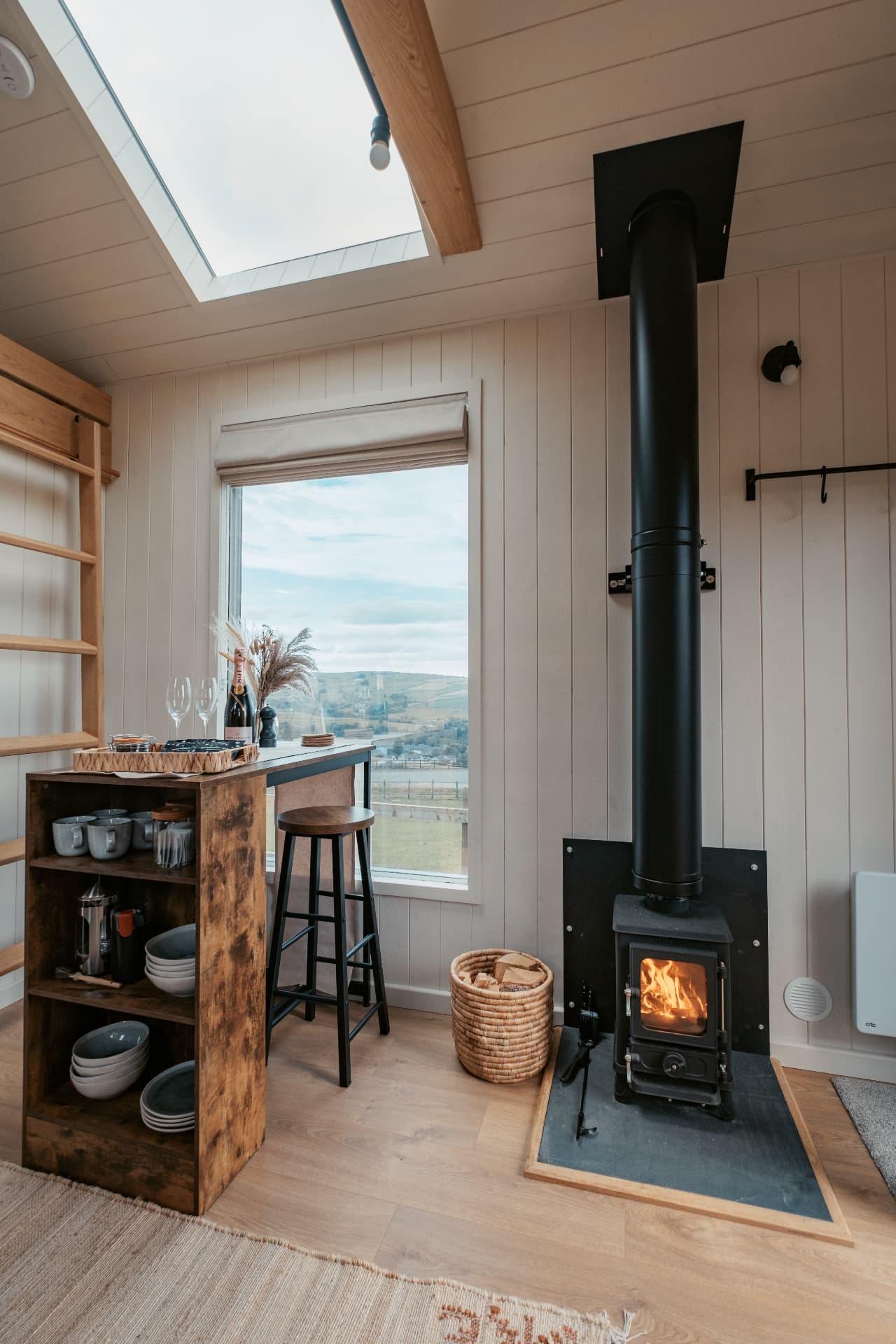 The wood burner glowing inside The Bothy