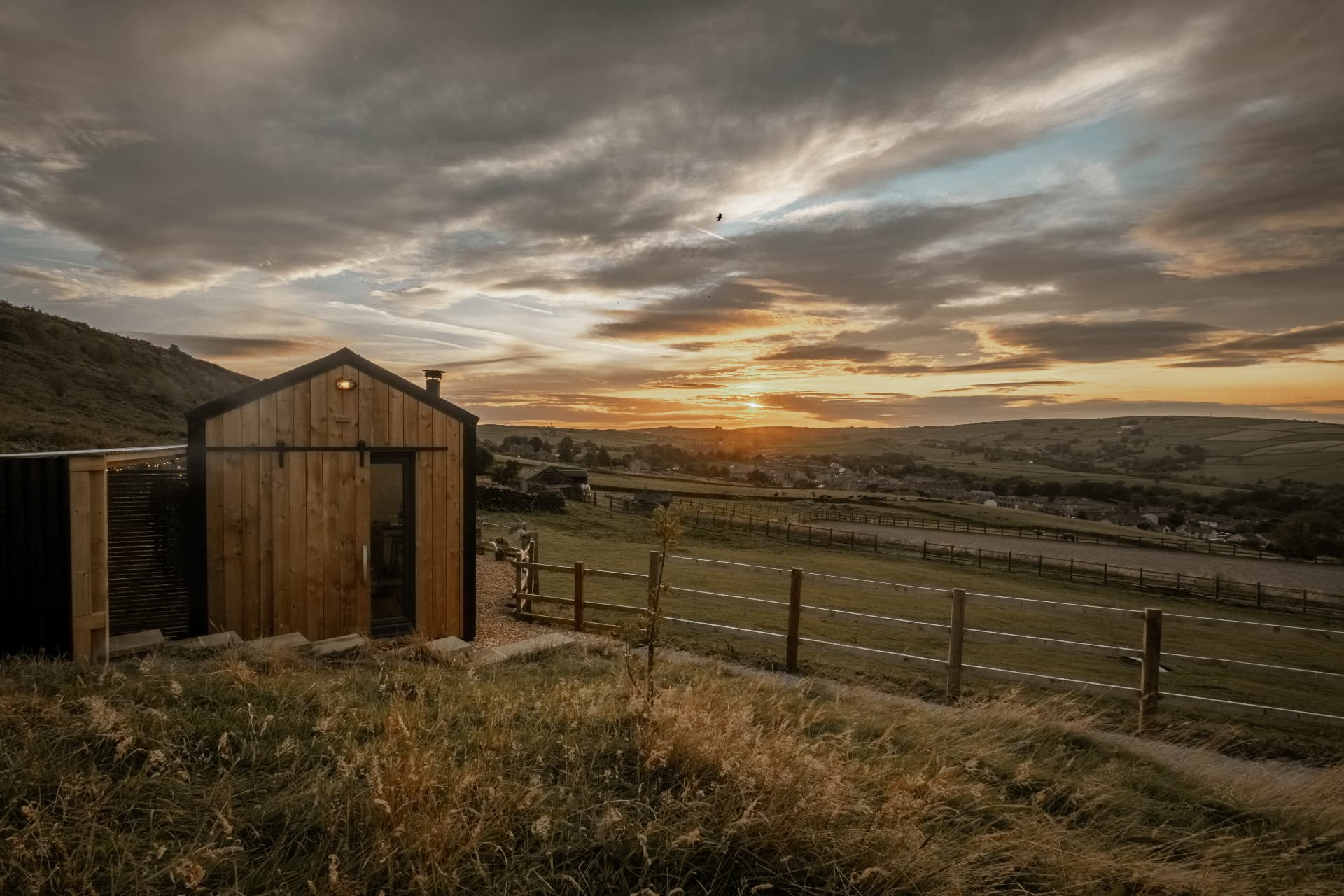 A cabin on the hillside above the Yorkshire Dales at sunrise